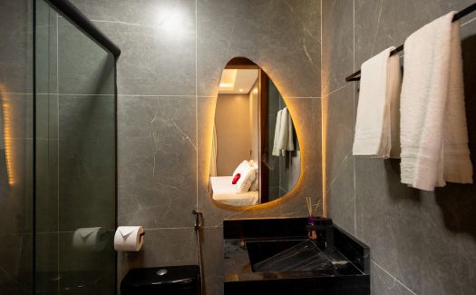 Quarto Triplo do Milos Hotel — detalhe da cama