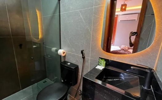 Quarto Triplo do Milos Hotel — detalhe da cama